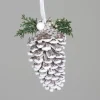 Décoration à suspendre pomme de pin enneigée blanche - 16 cm